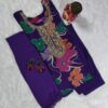 Woman wearing purple silk blend floral print suit with embroidered neckline and matching dupatta