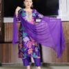Woman wearing purple silk blend floral print suit with embroidered neckline and matching dupatta