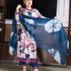 Traditional Indian cotton suit set featuring floral kurta, embroidered pants, and stylish dupatta