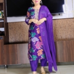 Woman wearing purple silk blend floral print suit with embroidered neckline and matching dupatta