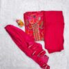 Woman wearing bright pink silk blend suit set with abstract multicolor print, embroidered neckline, and matching dupatta