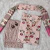 Woman wearing elegant white and pink floral Cambric Cotton suit set with kurta, printed pant, and dupatta – ethnic wear for women.