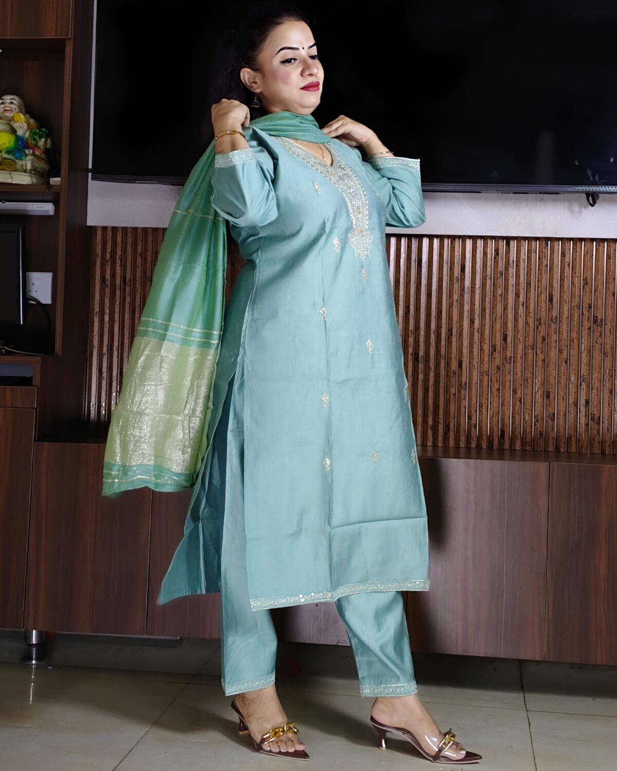 Elegant green Vatican fabric suit set with embroidered V-neck kurta, straight pants, and silk-finish dupatta