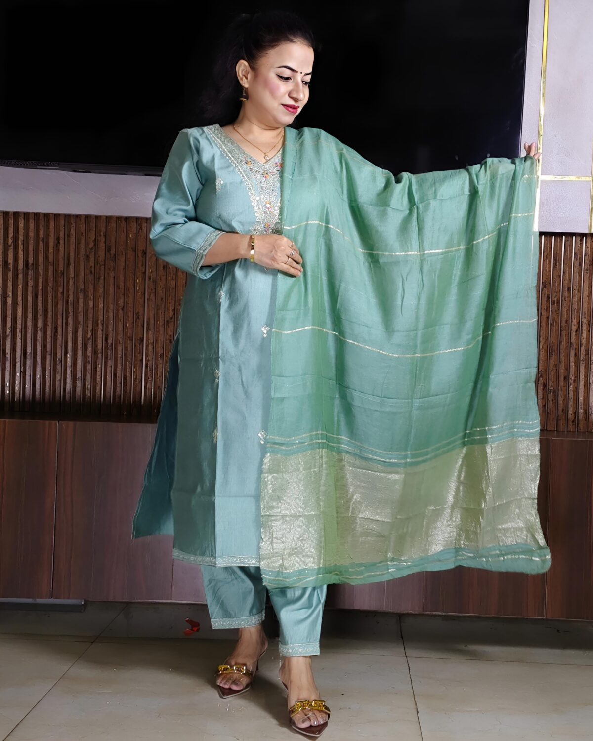 Elegant green Vatican fabric suit set with embroidered V-neck kurta, straight pants, and silk-finish dupatta