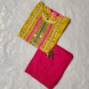 Woman wearing yellow and pink embroidered salwar suit with printed dupatta