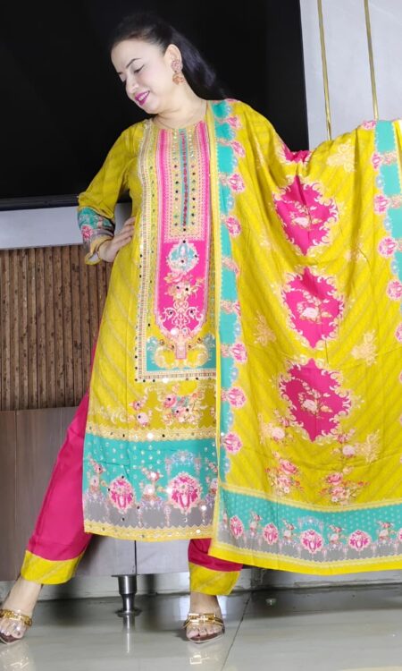 Woman wearing yellow and pink embroidered salwar suit with printed dupatta