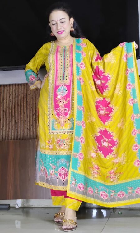 Woman wearing yellow and pink embroidered salwar suit with printed dupatta