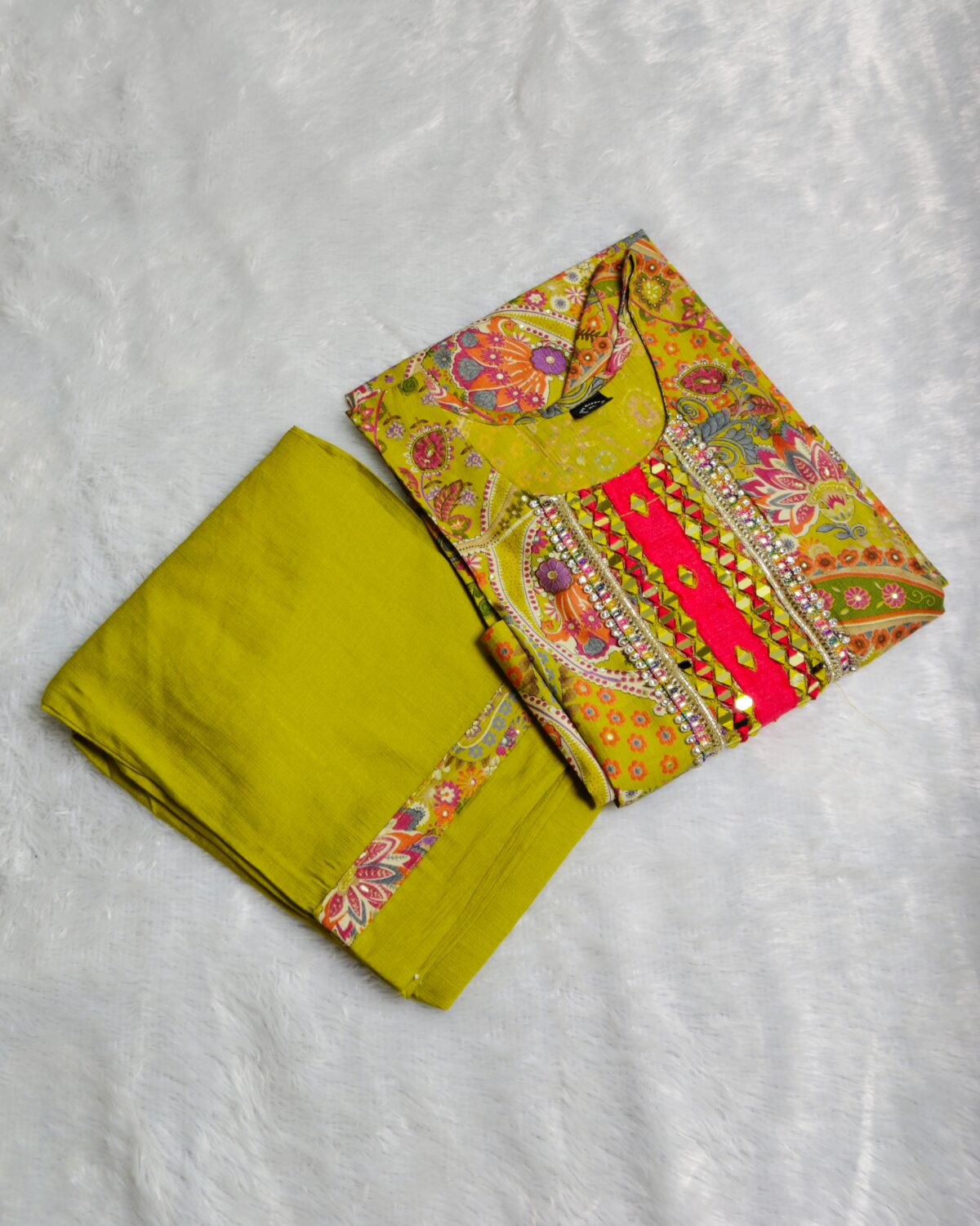Yellow silk kurta set with paisley embroidery, mirror work, and matching floral dupatta – Indian festive outfit