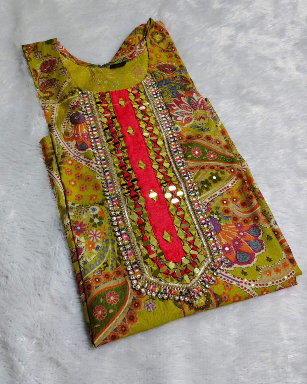 Yellow silk kurta set with paisley embroidery, mirror work, and matching floral dupatta – Indian festive outfit