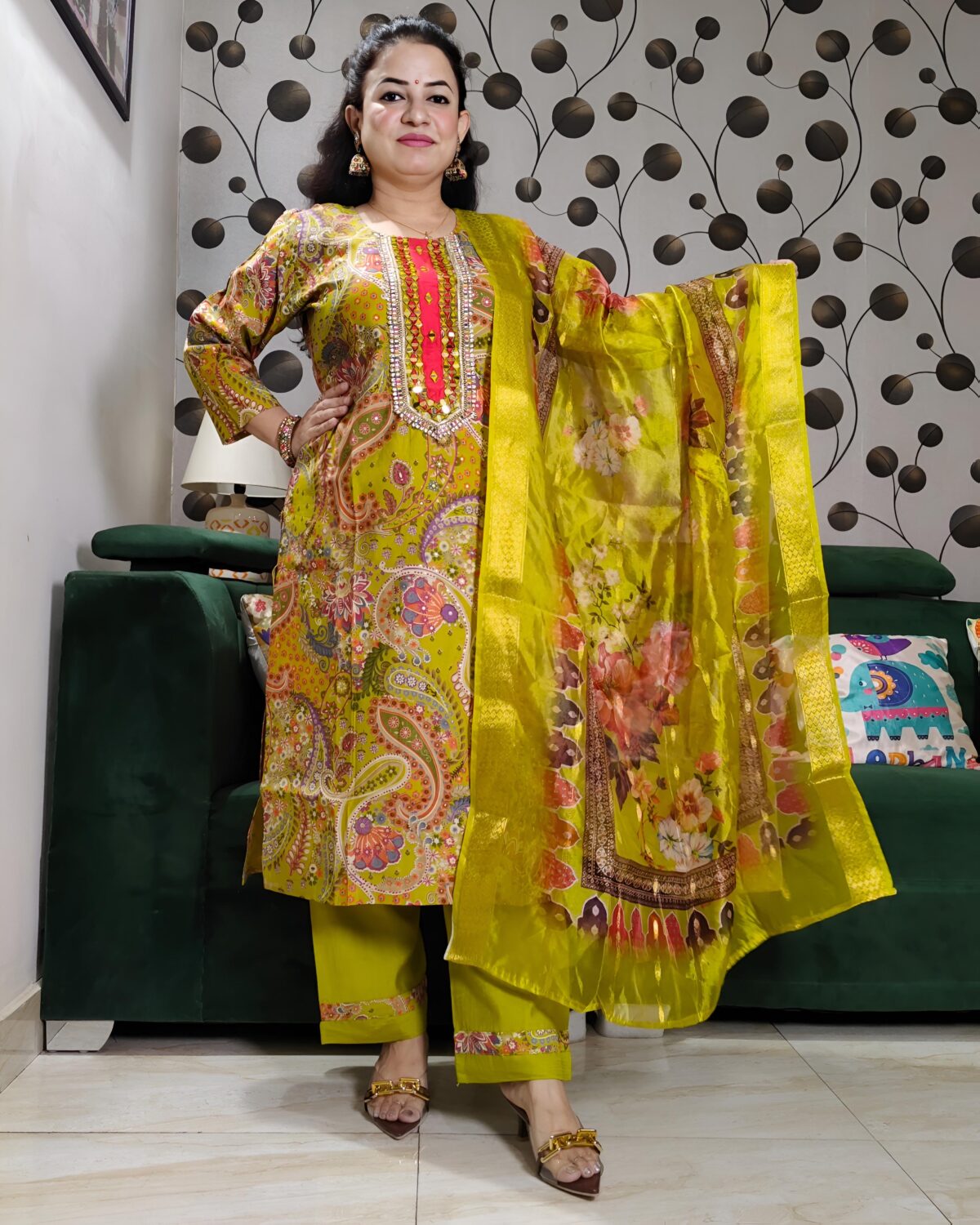 Yellow silk kurta set with paisley embroidery, mirror work, and matching floral dupatta – Indian festive outfit