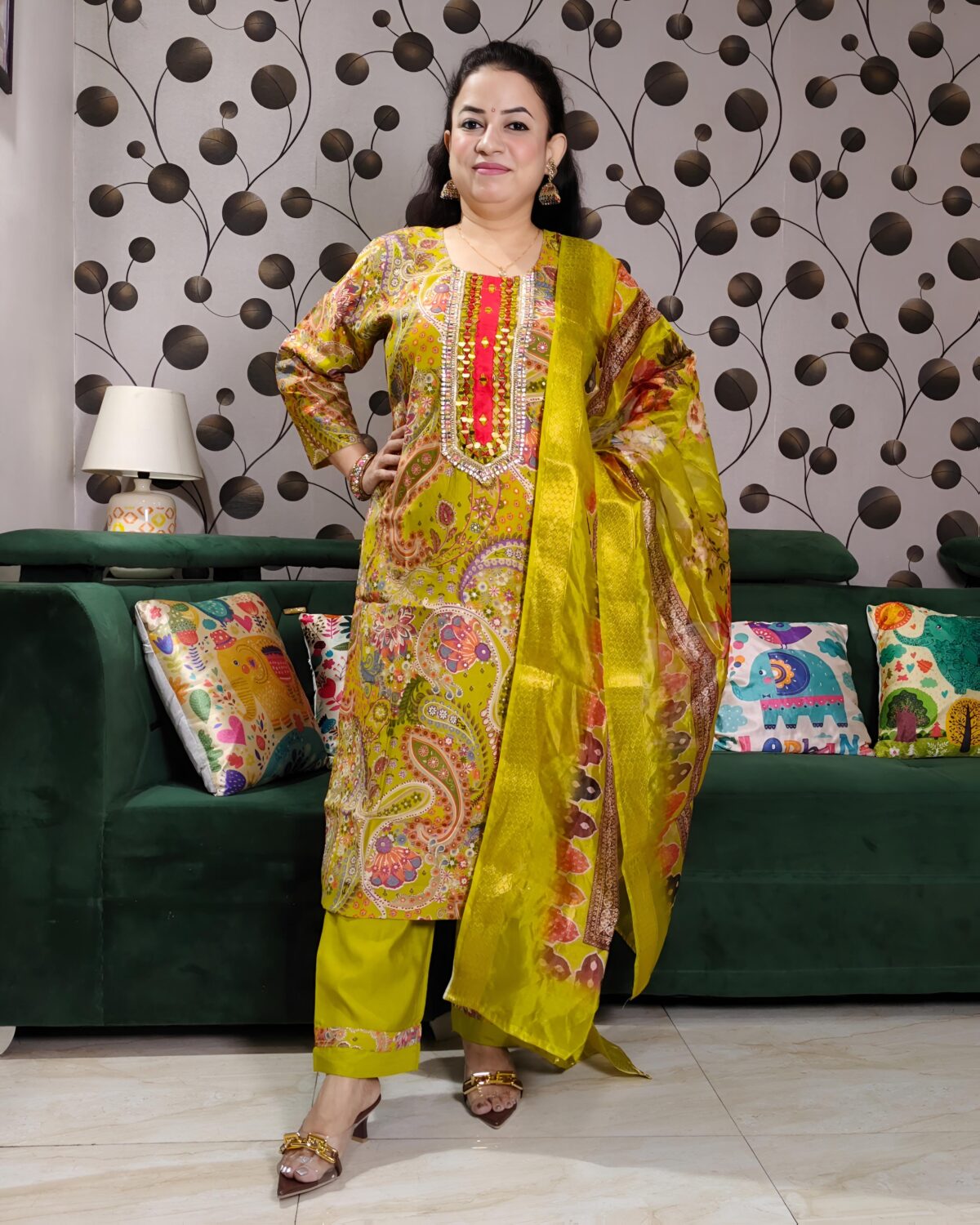 Yellow silk kurta set with paisley embroidery, mirror work, and matching floral dupatta – Indian festive outfit