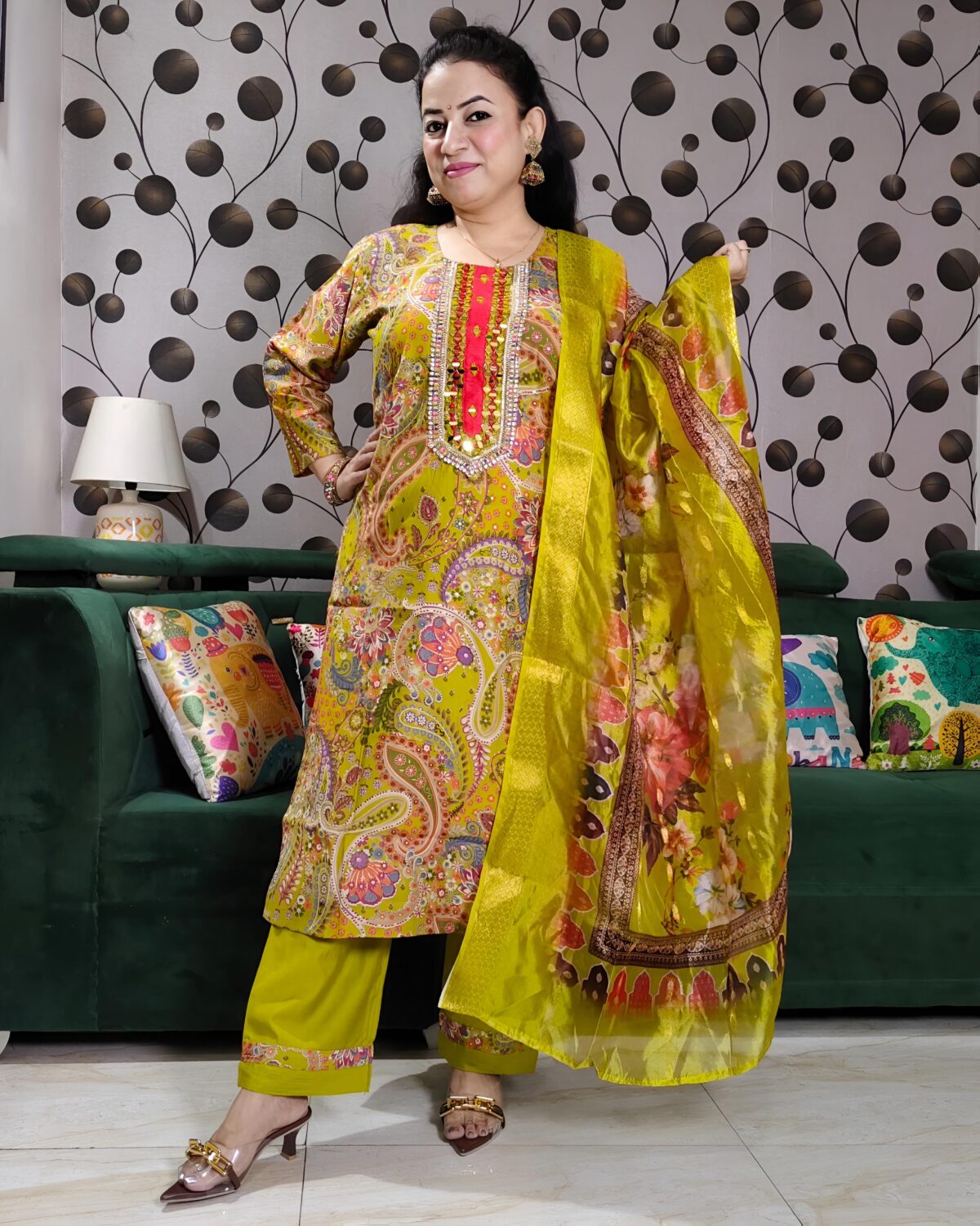 Yellow silk kurta set with paisley embroidery, mirror work, and matching floral dupatta – Indian festive outfit