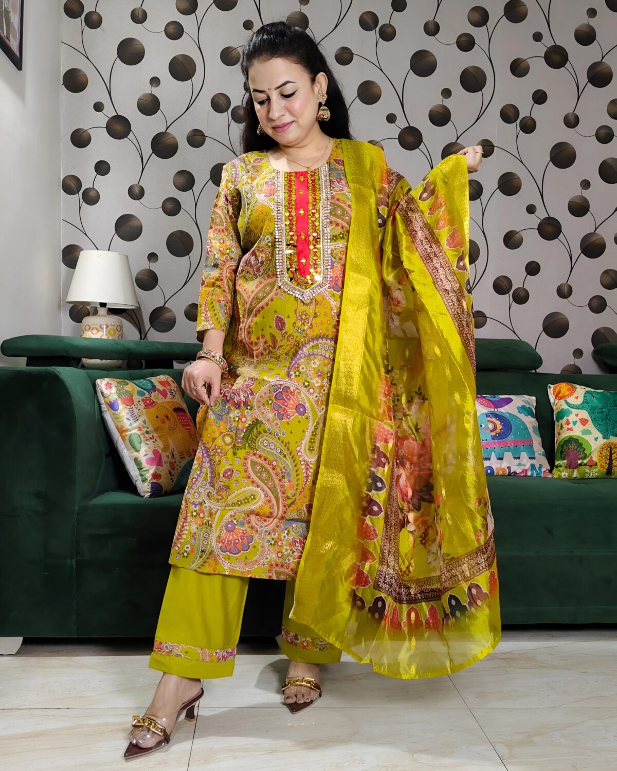 Yellow silk kurta set with paisley embroidery, mirror work, and matching floral dupatta – Indian festive outfit