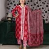 Woman wearing a premium rust handblock printed cotton suit set featuring lace-detailed V-neck kurta, printed pants, and matching dupatta.