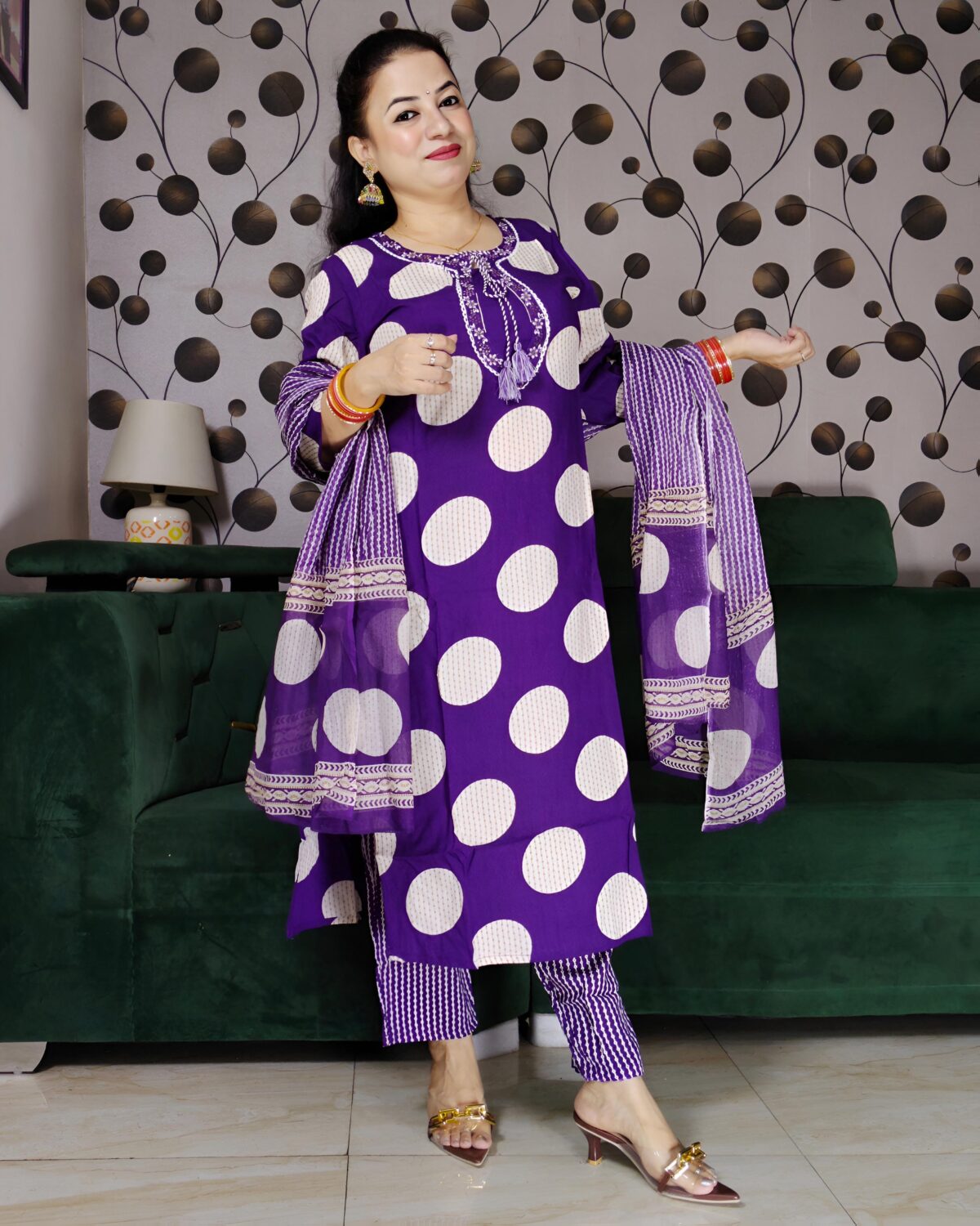 Woman wearing a premium cotton purple polka print suit set with matching pants and dupatta
