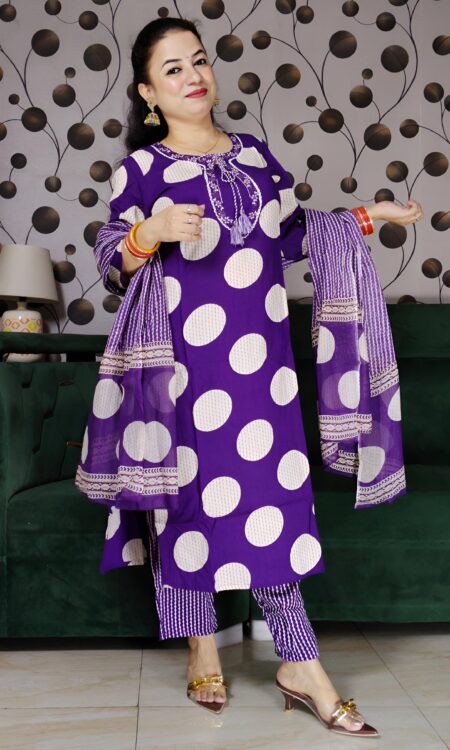 Woman wearing a premium cotton purple polka print suit set with matching pants and dupatta