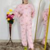 woman wearing blue printed winter fleece night suit with floral and fruit pattern