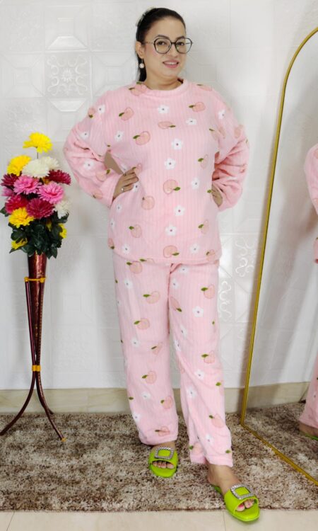 woman wearing blue printed winter fleece night suit with floral and fruit pattern