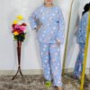 woman wearing blue printed winter fleece night suit with floral and fruit pattern