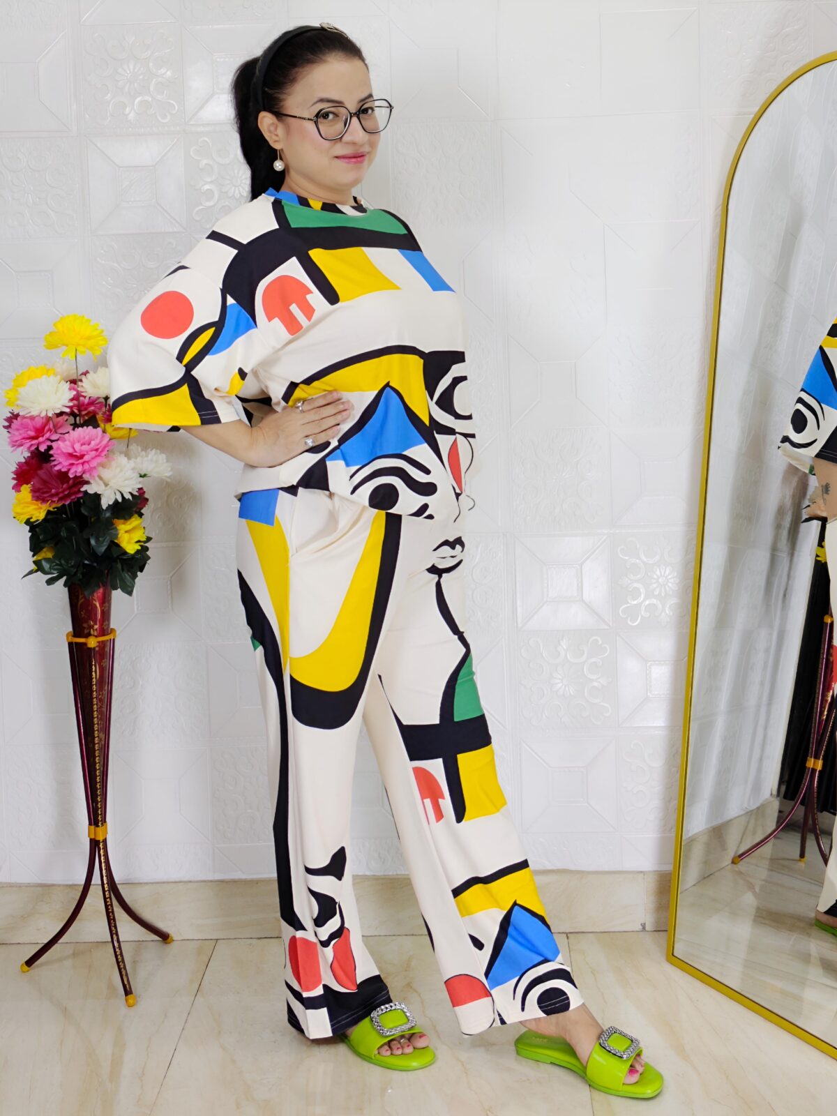 woman wearing colorful abstract print co-ord set with geometric abstract design