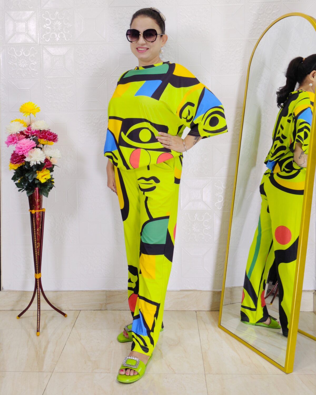 woman wearing colorful abstract print co-ord set with geometric abstract design