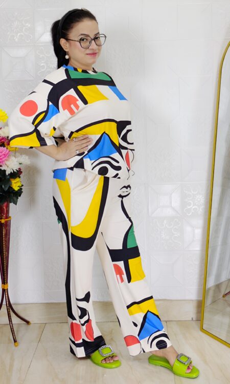 woman wearing colorful abstract print co-ord set with geometric abstract design