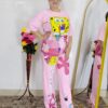 woman wearing pink cartoon print co-ord set featuring SpongeBob design