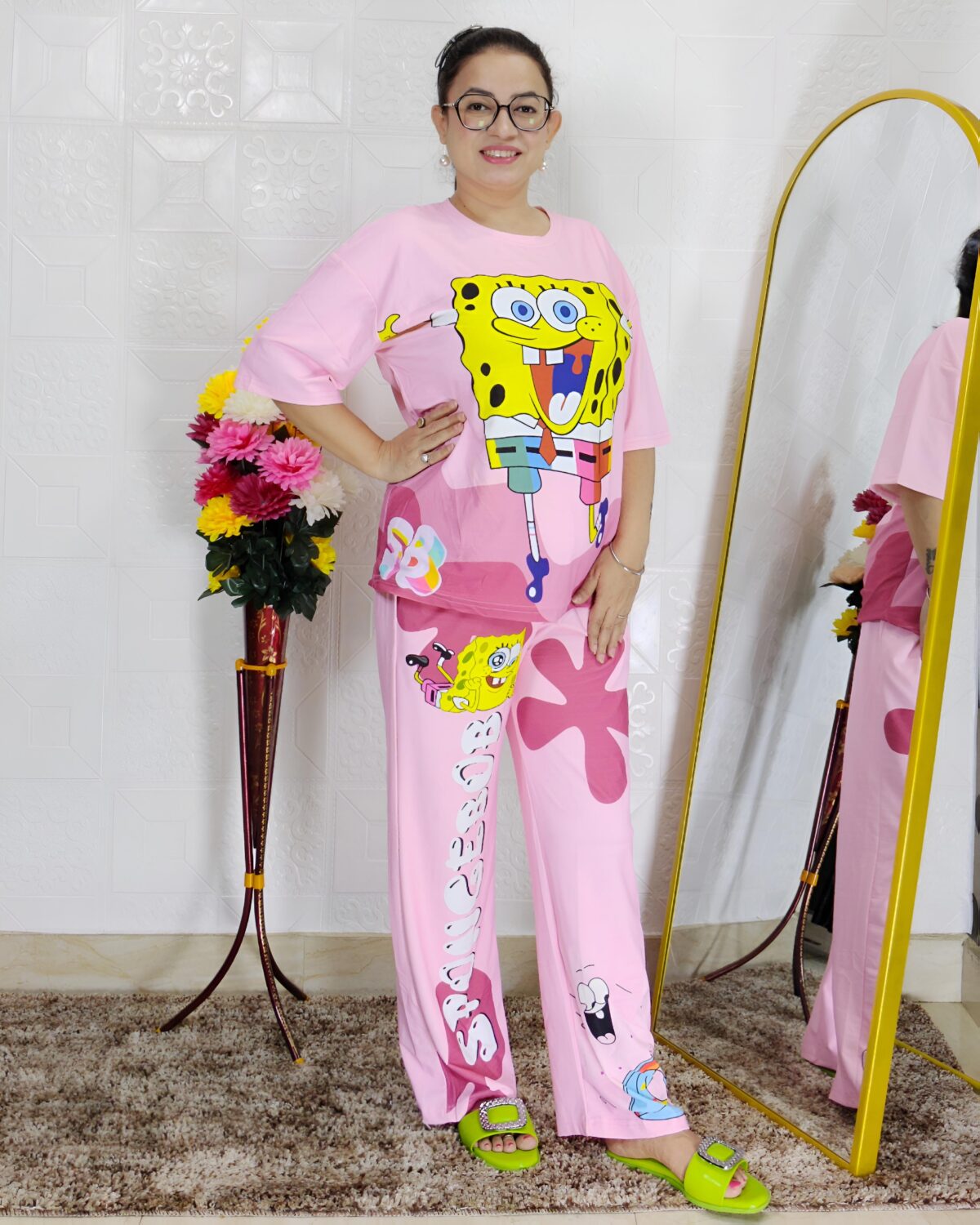 woman wearing pink cartoon print co-ord set featuring SpongeBob design