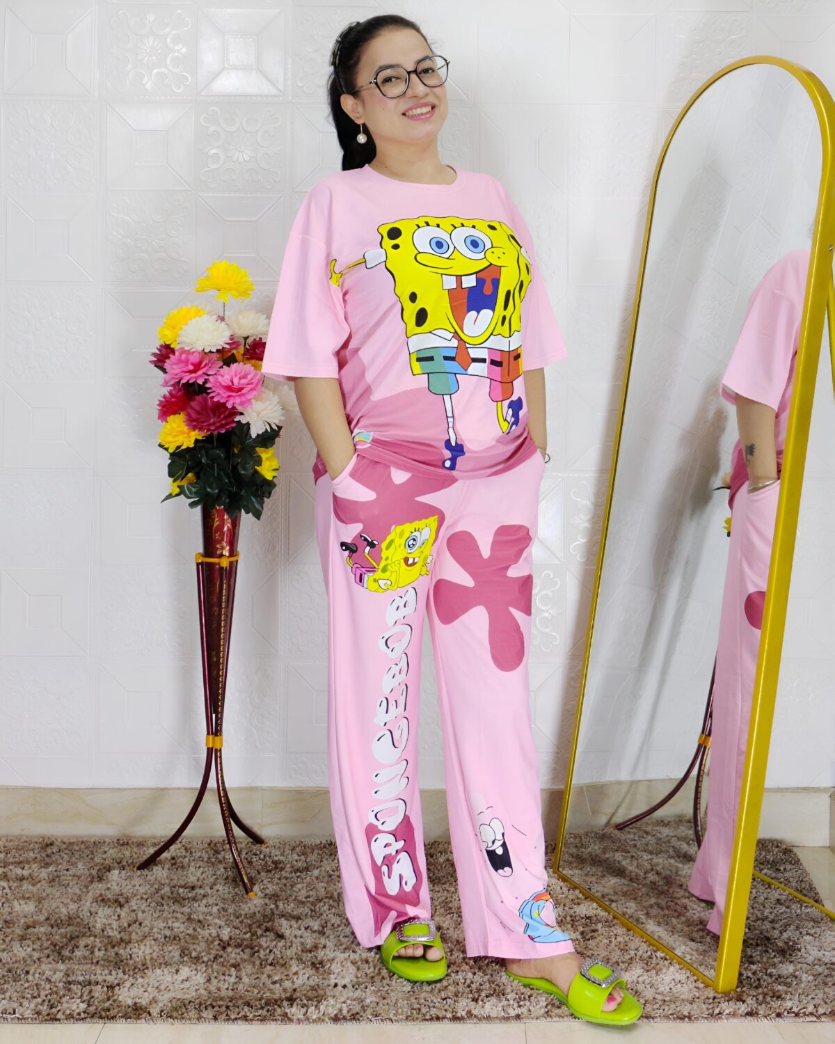 woman wearing pink cartoon print co-ord set featuring SpongeBob design