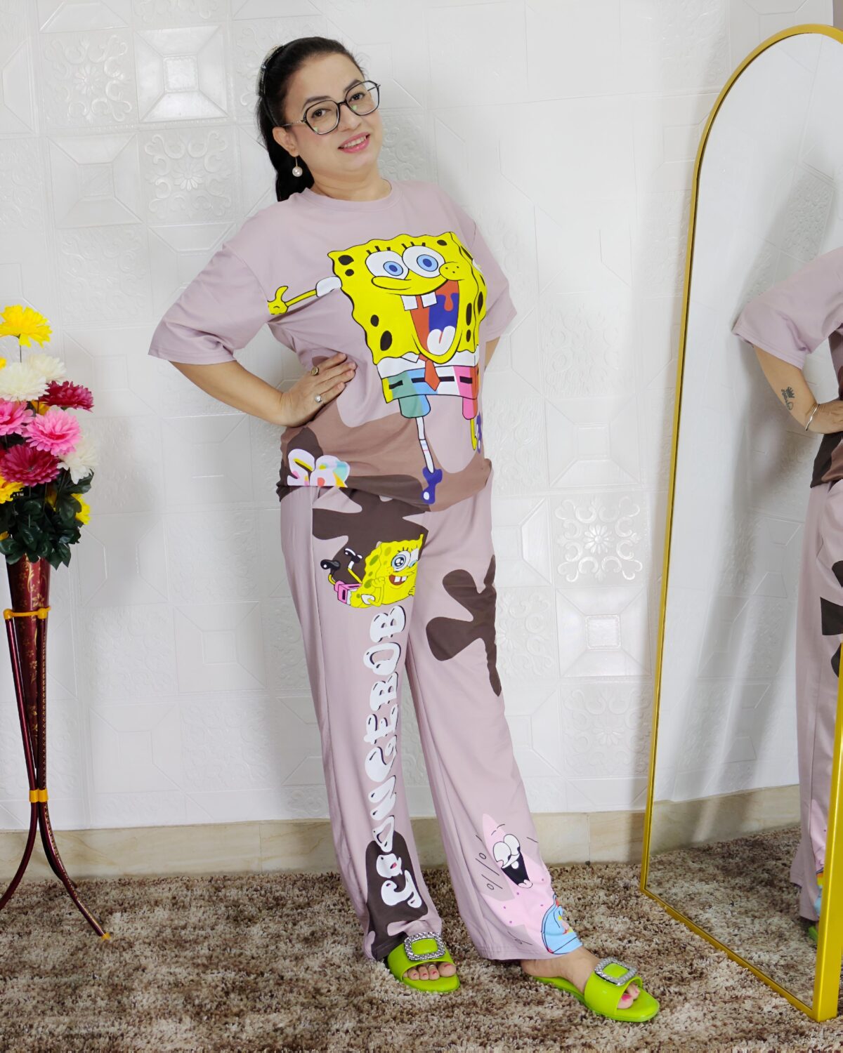 woman wearing pink cartoon print co-ord set featuring SpongeBob design