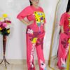 woman wearing pink cartoon print co-ord set featuring SpongeBob design