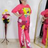 woman wearing pink cartoon print co-ord set featuring SpongeBob design