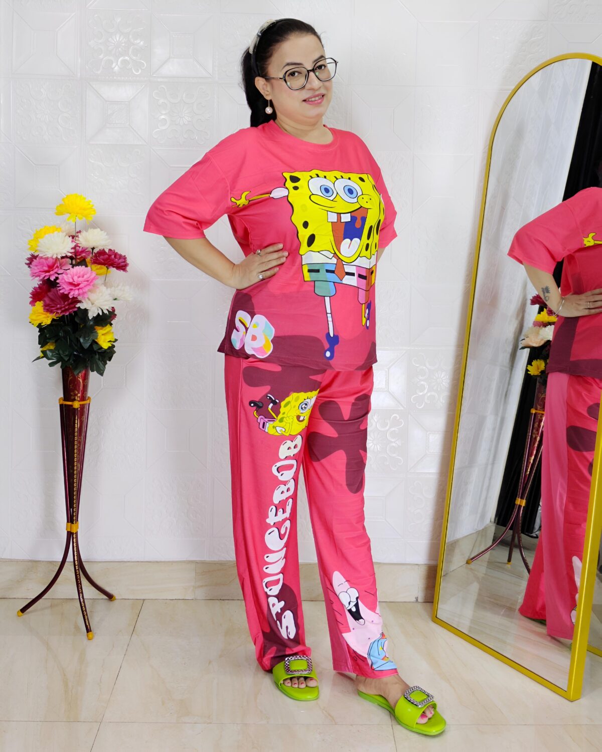 woman wearing pink cartoon print co-ord set featuring SpongeBob design