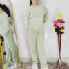 Woman wearing a black and white premium knitted co-ord set with a geometric patterned top and solid black pants