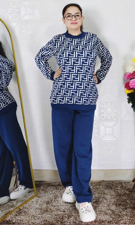 Woman wearing a maroon and white premium knitted co-ord set with a geometric patterned top and solid maroon pants