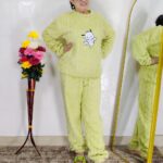 woman wearing beige soft furry winter night suit with cute cartoon embroidery