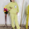 woman wearing beige soft furry winter night suit with cute cartoon embroidery