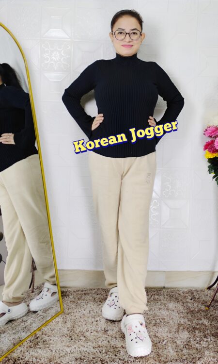 Woman wearing a soft grey Korean plush jogger lower paired with a black winter top