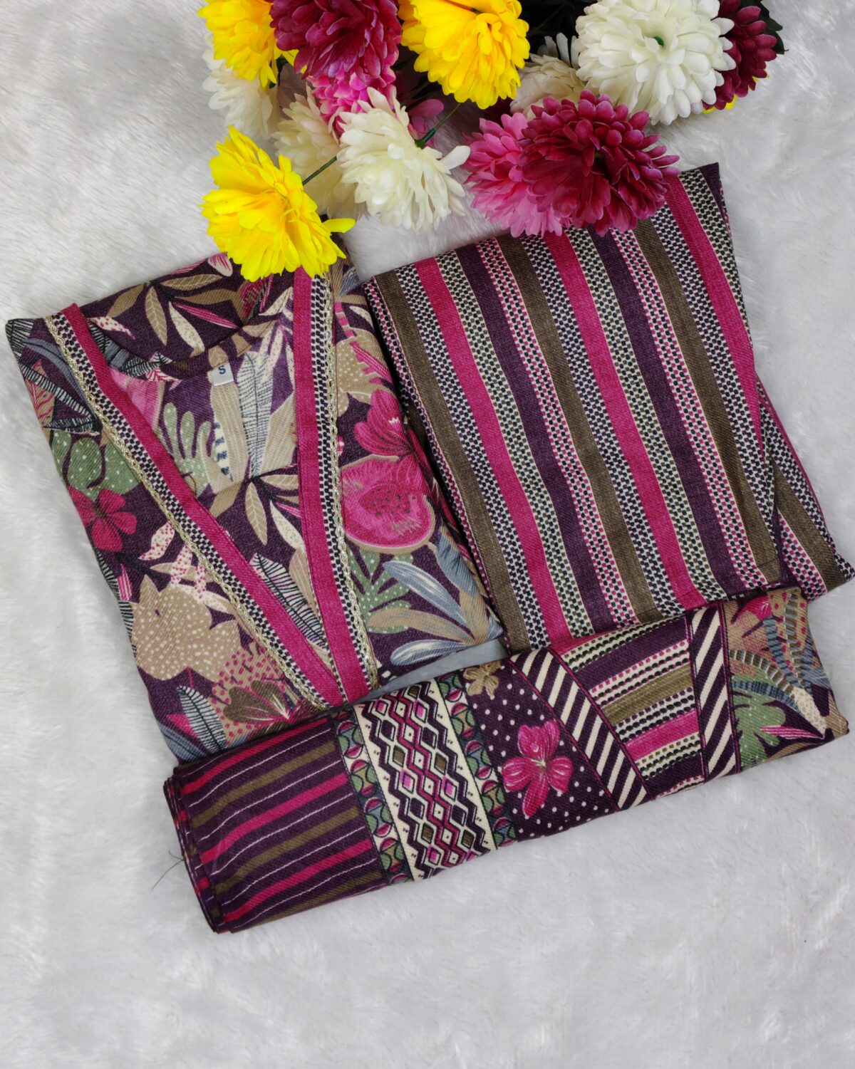 Woman wearing a premium printed pashmina suit with matching dupatta and winter bottom