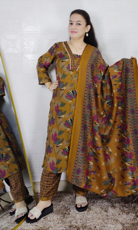 Woman wearing a premium printed pashmina suit with matching dupatta and winter bottom