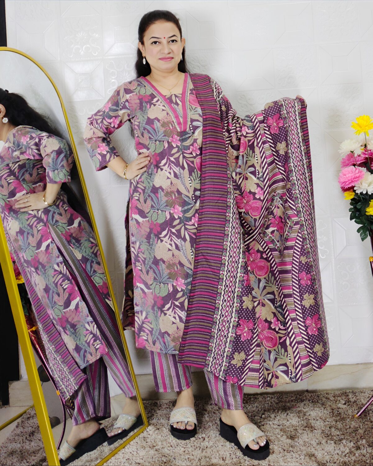 Woman wearing a premium printed pashmina suit with matching dupatta and winter bottom
