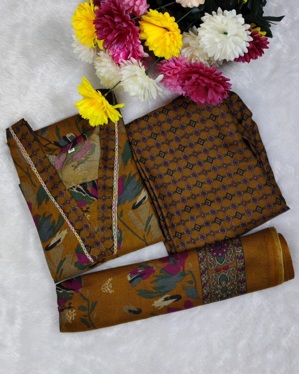 Woman wearing a premium printed pashmina suit with matching dupatta and winter bottom