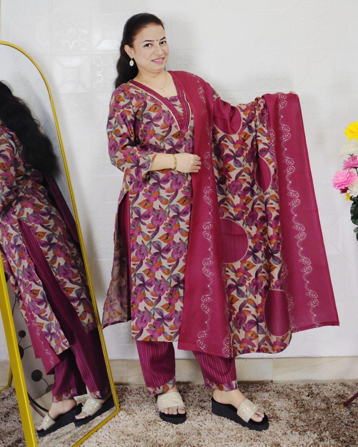 Woman wearing a premium printed pashmina suit with matching dupatta and winter bottom