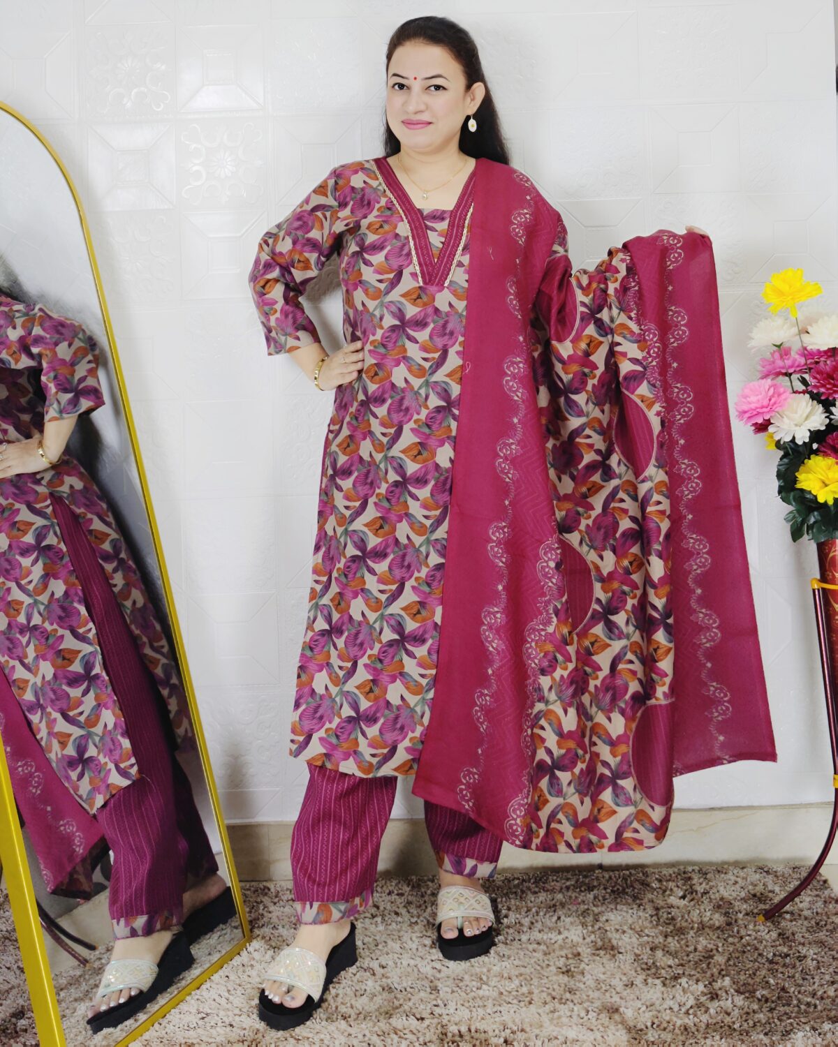 Woman wearing a premium printed pashmina suit with matching dupatta and winter bottom