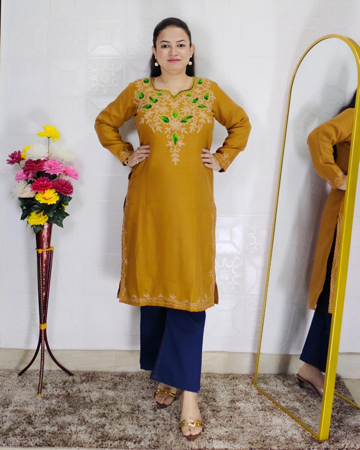 Women wearing embroidered pheran kurti winter ethnic wear long kurti with floral embroidery