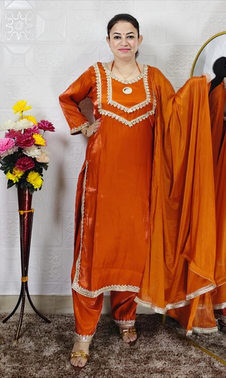 Women wearing orange Roman glass fabric embroidered kurta pant dupatta set ethnic wear suit