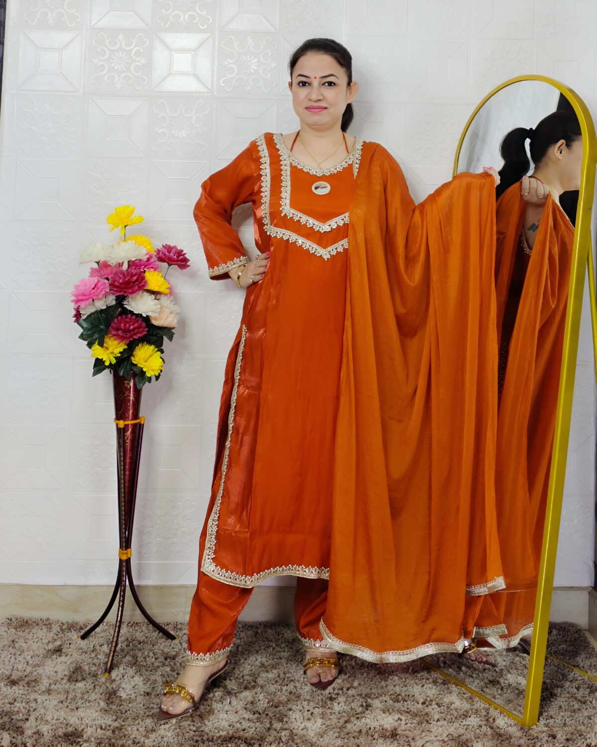 Women wearing orange Roman glass fabric embroidered kurta pant dupatta set ethnic wear suit
