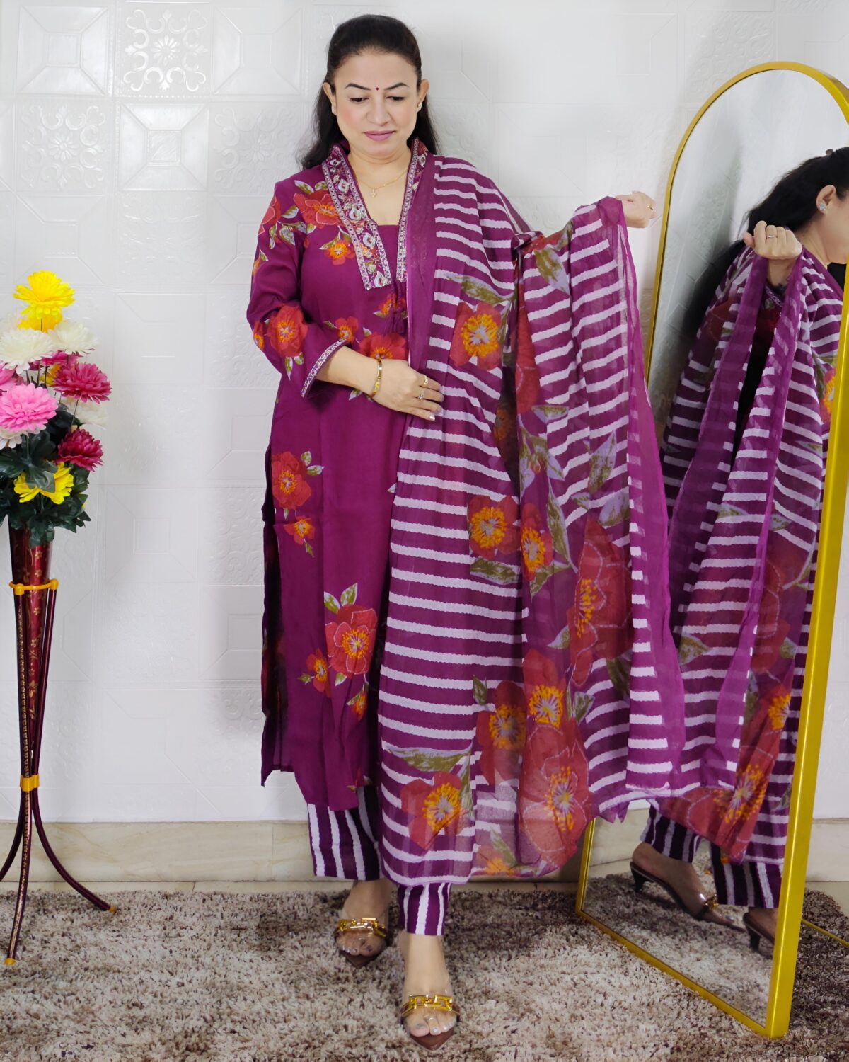 Women wearing purple floral printed pure cotton kurta pant dupatta suit set