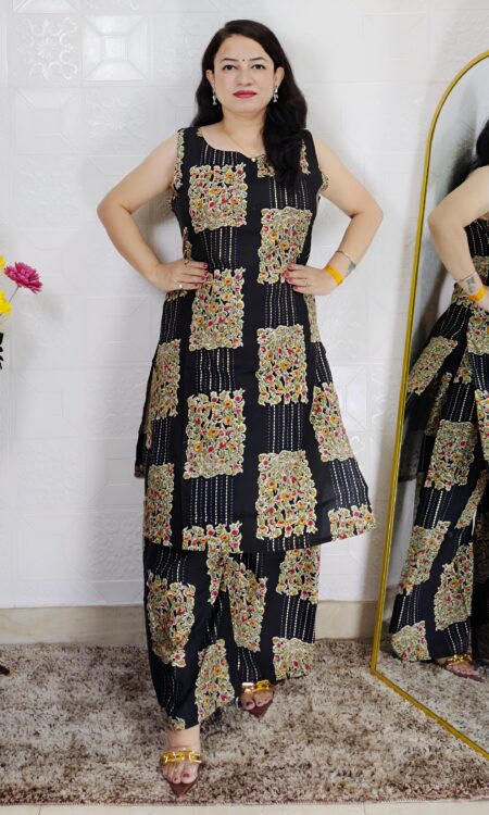 Woman wearing black floral printed cotton co-ord set with sleeveless kurta and matching pants