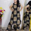 Woman wearing black floral printed cotton co-ord set with sleeveless kurta and matching pants